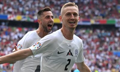 Zan Karnicnik celebrates after giving Slovenia the lead against Serbia