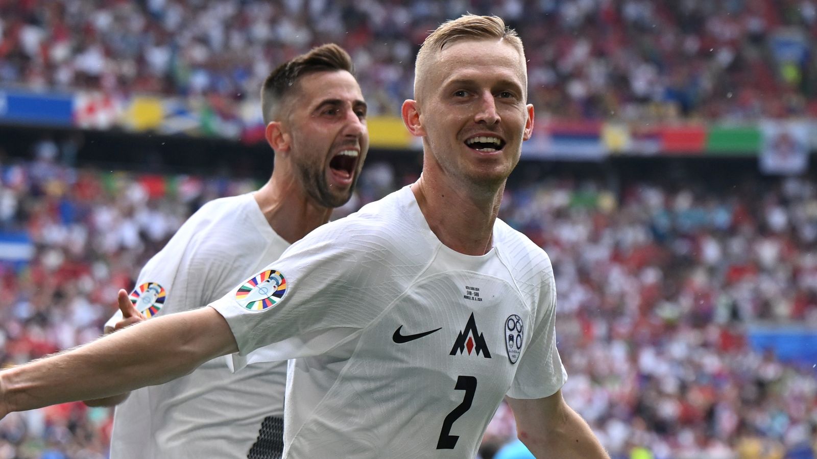 Zan Karnicnik celebrates after giving Slovenia the lead against Serbia