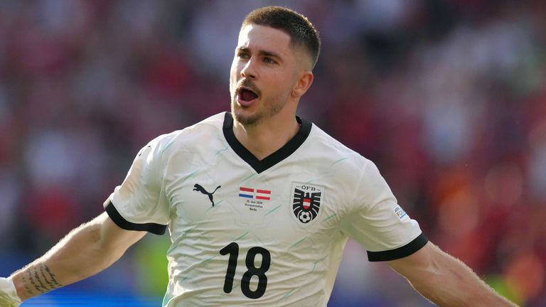 Romano Schmid celebrates after restoring Austria's lead against the Netherlands