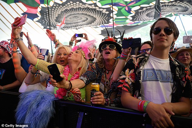 Fans enjoy the performance on the Pyramid Stage