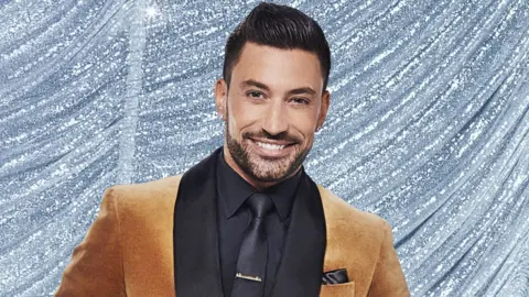 BBC Giovanni Pernice in a brown and black suit