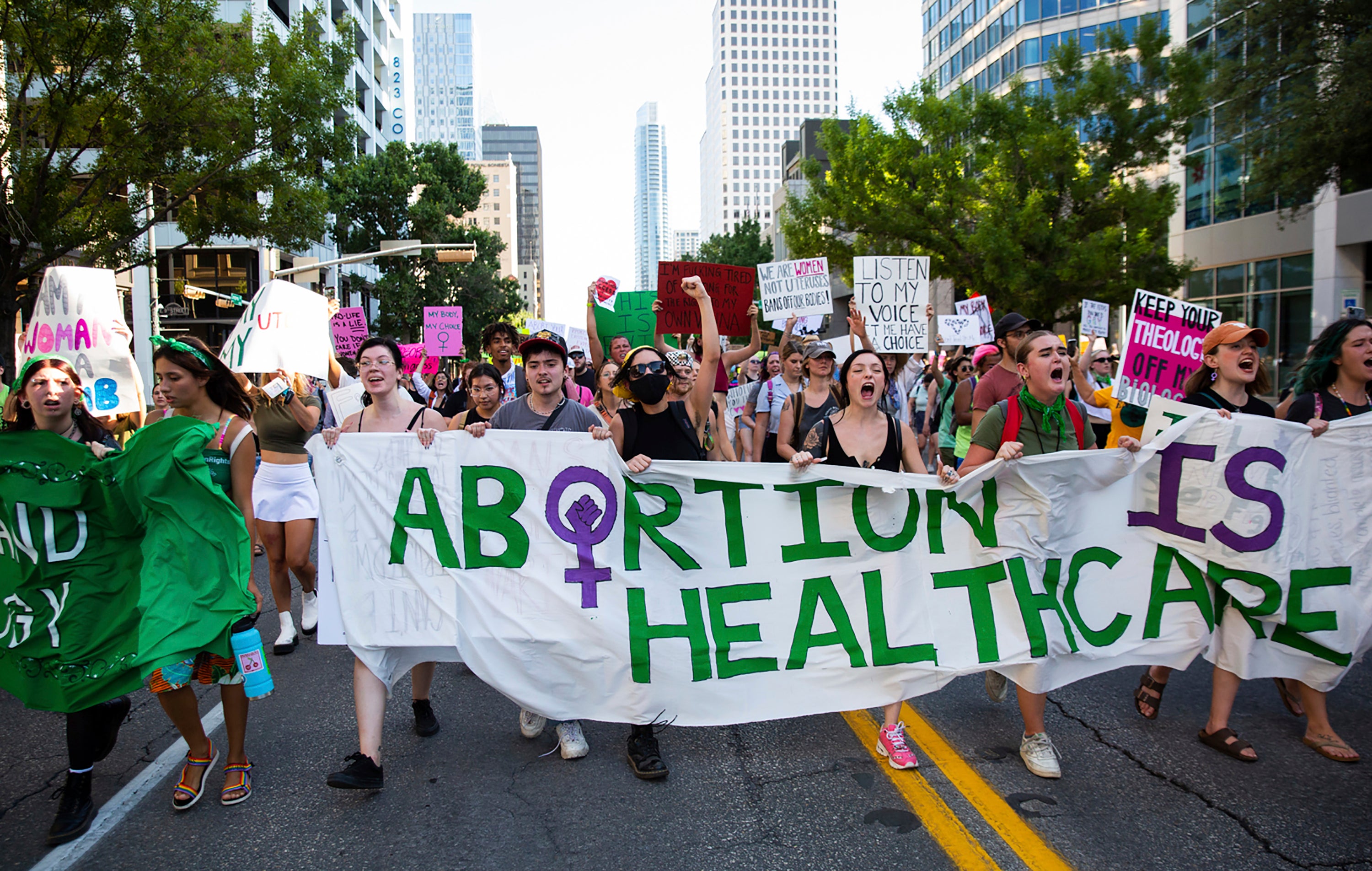 Protesters march down Congress Avenue in downtown Austin, Texas, following the Supreme Court decision to overturn Roe v Wade