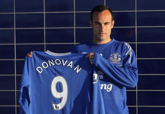 Landon Donovan pictured holding up an Everton shirt after joining the Premier League club on loan