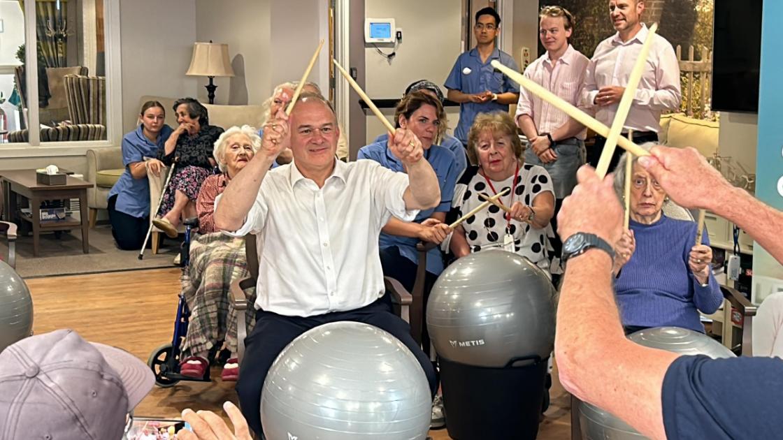 Lib Dem leader Ed Davey drums at care home in Romsey on campaign tour