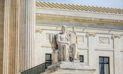 A statute on the steps on the Supreme Court