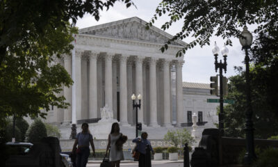 3 people standing in front of the US Supreme Court