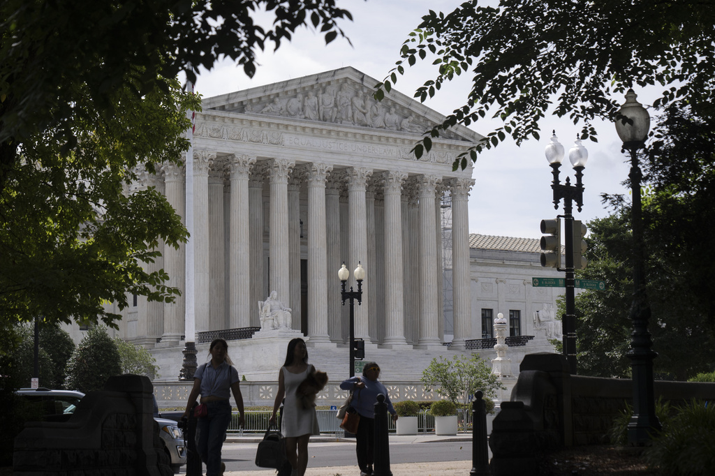 3 people standing in front of the US Supreme Court