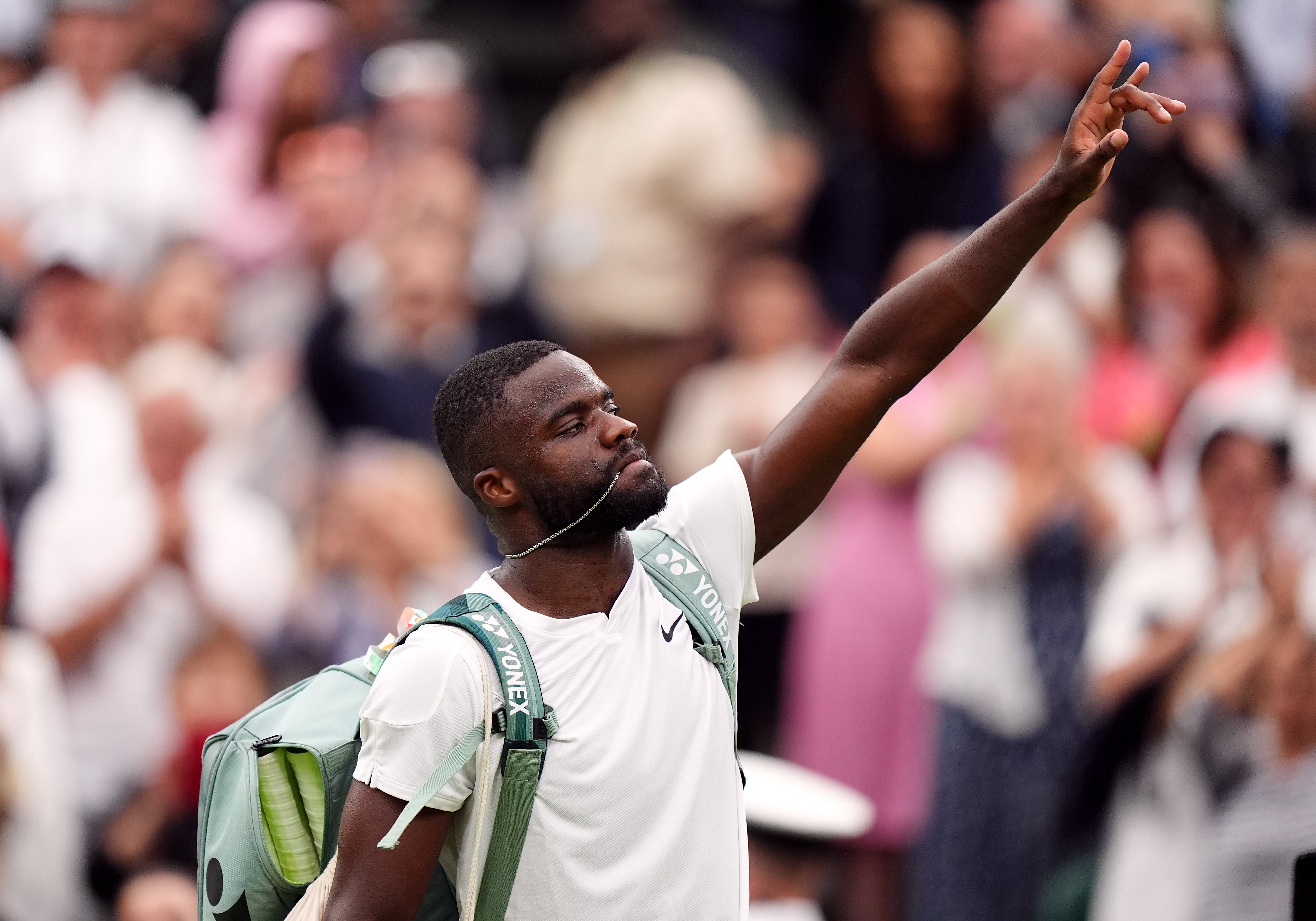 Tiafoe salutes the Centre Court crowd after defeat