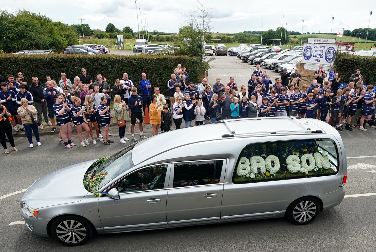 Mourners line the streets to pay final respects to Rob Burrow ahead of funeral