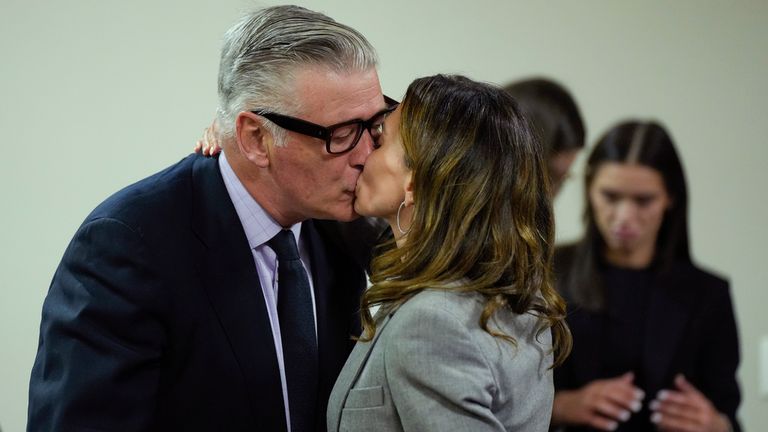 Hilaria Baldwin kisses her husband, actor Alec Baldwin, during his trial for involuntary manslaughter for the 2021 fatal shooting of cinematographer Halyna Hutchins during filming of the Western movie 