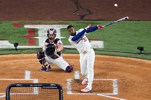 Dodgers outfielder Teoscar Hernández hits a home run during the...