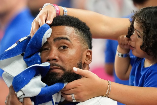 Dodgers outfielder Teoscar Hernández gets toweled off during the All-Star...