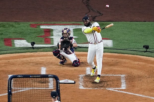 The Atlanta Braves’ Marcell Ozuna hits a home run during...