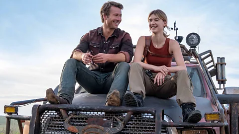 Universal Glenn Powell alongside Daisy Edgar-Jones in his latest film Twisters – which utilises his swaggering Texan charm well (Credit: Universal)