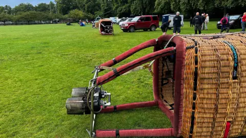 A hot-air balloon basket on its side