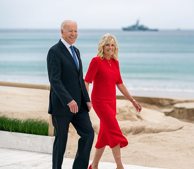 President Joe Biden and First Lady Jill Biden walk along the beach at the Carbis Bay Hotel and Estate for the G7 welcome ceremony Friday, June 11, 2021 in St. Ives, Cornwall, England