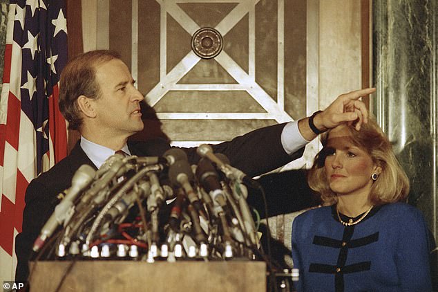 Sen. Joe Biden, D-Del., with Jill Biden, gestures during a news conference on Capitol Hill to announce his decision to withdraw as a candidate for the 1988 Democratic presidential nomination