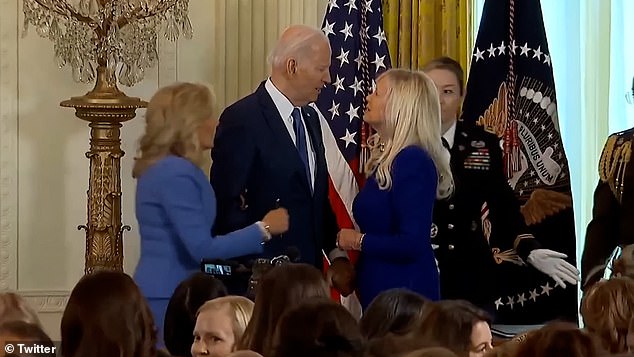 In March this year, Jill had to emerge on stage and tug on a confused Joe's arm when he was seemingly about to plant a kiss on the cheek of another blonde woman - who, like Jill, has wearing a blue suit