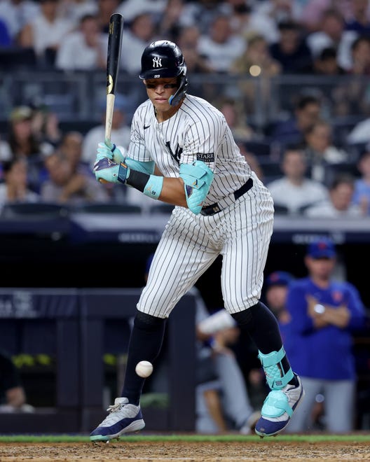 Jul 24, 2024; Bronx, New York, USA; New York Yankees center fielder Aaron Judge (99) is hit by a pitch during the fifth inning against the New York Mets at Yankee Stadium. Mandatory Credit: Brad Penner-USA TODAY Sports