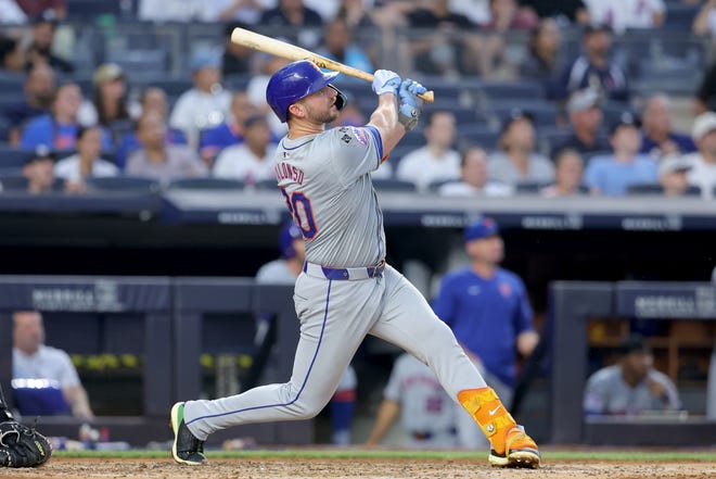 Jul 24, 2024; Bronx, New York, USA; New York Mets first baseman Pete Alonso (20) follows through on a two run home run against the New York Yankees during the fourth inning at Yankee Stadium. Mandatory Credit: Brad Penner-USA TODAY Sports