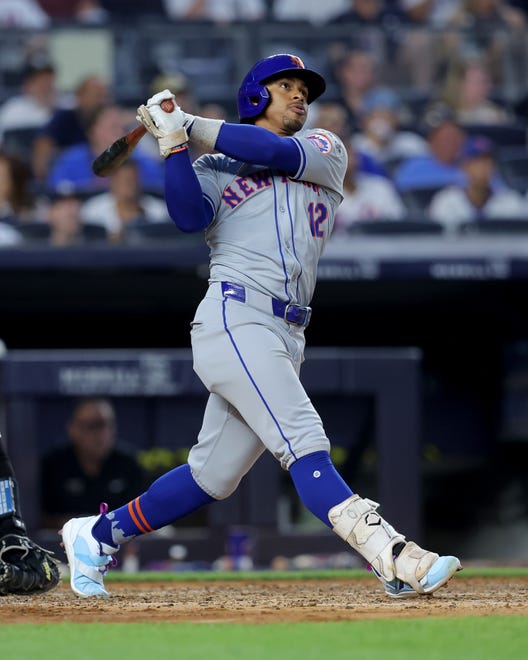 Jul 24, 2024; Bronx, New York, USA; New York Mets shortstop Francisco Lindor (12) follows through on a two run home run against the New York Yankees during the fifth inning at Yankee Stadium. Mandatory Credit: Brad Penner-USA TODAY Sports