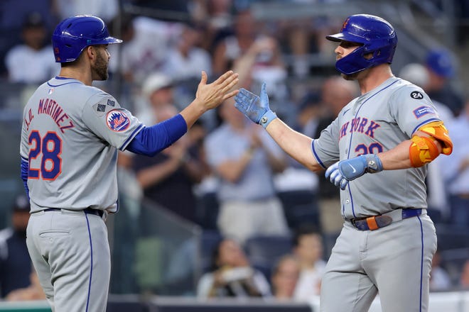 Jul 24, 2024; Bronx, New York, USA; New York Mets first baseman Pete Alonso (20) celebrates his two run home run against the New York Yankees with designated hitter J.D. Martinez (28) during the fourth inning at Yankee Stadium. Mandatory Credit: Brad Penner-USA TODAY Sports