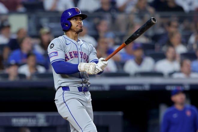 Jul 24, 2024; Bronx, New York, USA; New York Mets shortstop Francisco Lindor (12) watches his two run home run against the New York Yankees during the fifth inning at Yankee Stadium. Mandatory Credit: Brad Penner-USA TODAY Sports