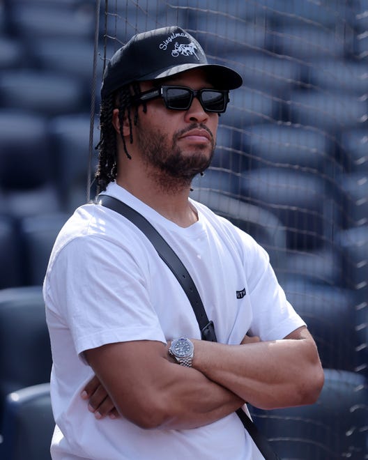 Jul 24, 2024; Bronx, New York, USA; New York Knicks guard Jalen Brunson watches batting practice before a game between the New York Yankees and the New York Mets at Yankee Stadium. Mandatory Credit: Brad Penner-USA TODAY Sports