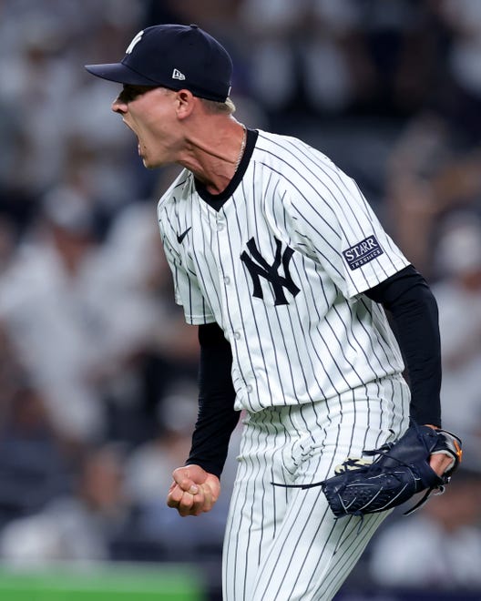 Jul 23, 2024; Bronx, New York, USA; New York Yankees relief pitcher Luke Weaver (30) reacts during the eighth inning against the New York Mets at Yankee Stadium. Mandatory Credit: Brad Penner-USA TODAY Sports