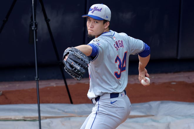 Jul 23, 2024; Bronx, New York, USA; New York Mets injured starting pitcher Kodai Senga (34) works out in the bullpen at Yankee Stadium before a game against the New York Yankees. Mandatory Credit: Brad Penner-USA TODAY Sports