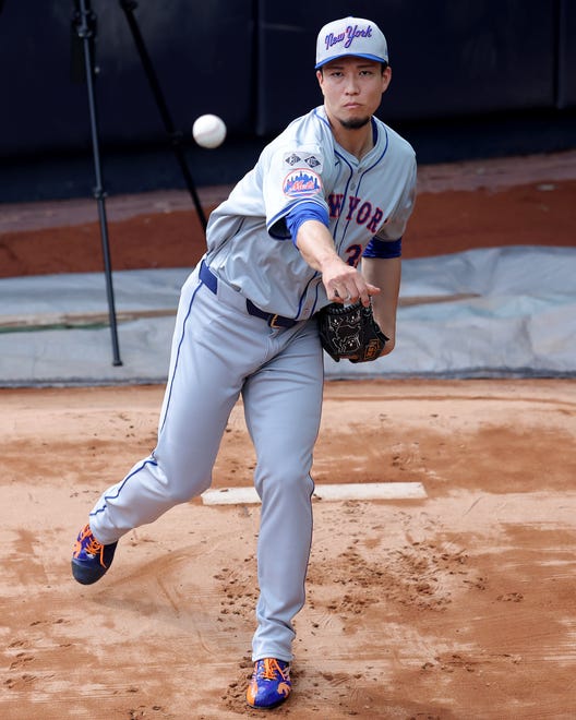 Jul 23, 2024; Bronx, New York, USA; New York Mets injured starting pitcher Kodai Senga (34) works out in the bullpen at Yankee Stadium before a game against the New York Yankees. Mandatory Credit: Brad Penner-USA TODAY Sports