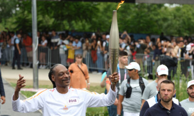 Why is Snoop Dogg at Olympics? Snoop Dogg carries the Olympic torch before opening ceremony in Paris