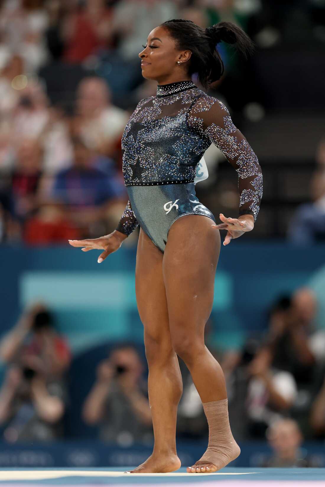 Simone Biles performed the floor exercise on Sunday with her ankle and calf taped.