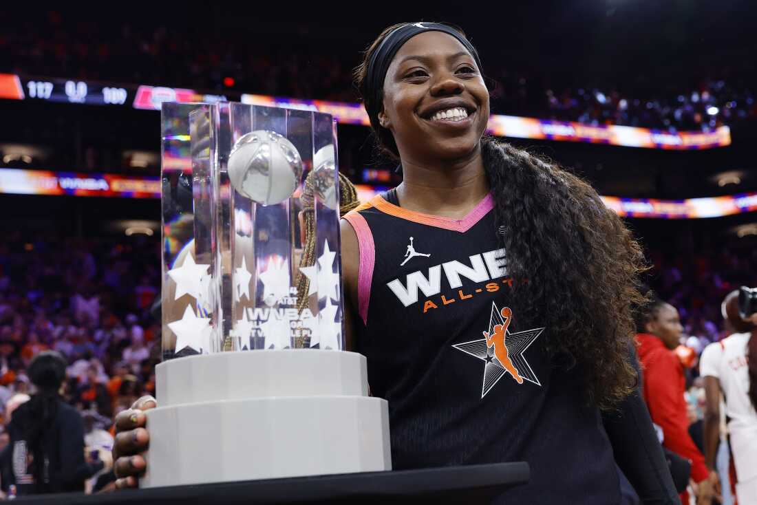 Arike Ogunbowale, who has left off the U.S Women's Olympic squad, celebrates with the MVP trophy after Team WNBA defeated the Olympic team 117-109 during the 2024 WNBA All Star Game in Phoenix, Ariz. on July 20, 2024.