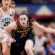 Indiana Fever guard Caitlin Clark (22) rushes up the court past New York Liberty guard Sabrina Ionescu (20) on Thursday, May 16, 2024, during the Indiana Fever home opener game against the New York Liberty at Gainbridge Fieldhouse in Indianapolis.