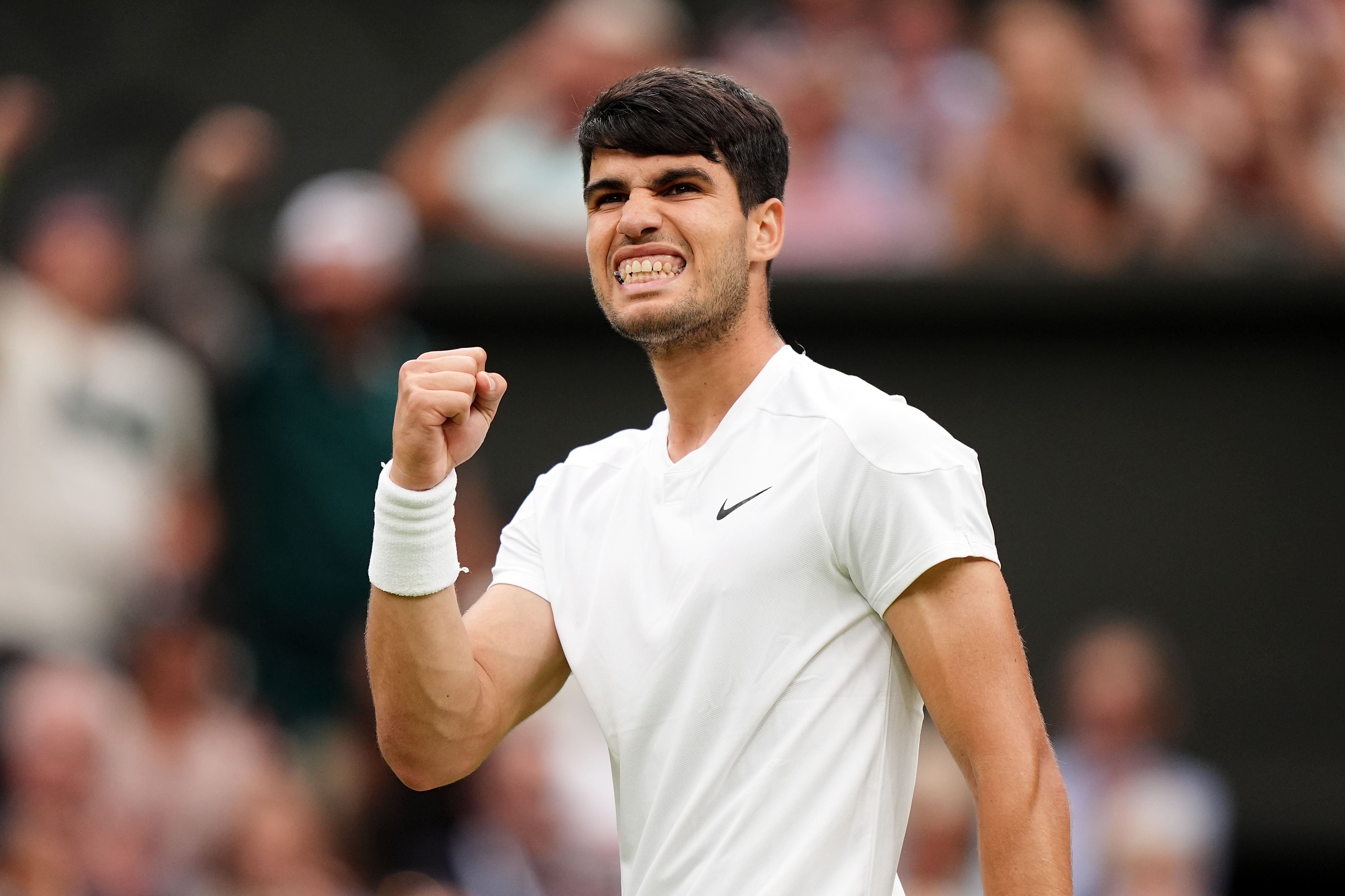 Alcaraz edged past Tiafoe in five sets