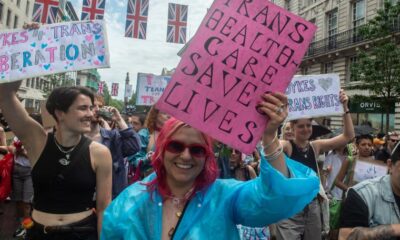 trans pride pic, protester holds placard reading trans healthcare saves lives, illustrating an article about the puberty blocker ban