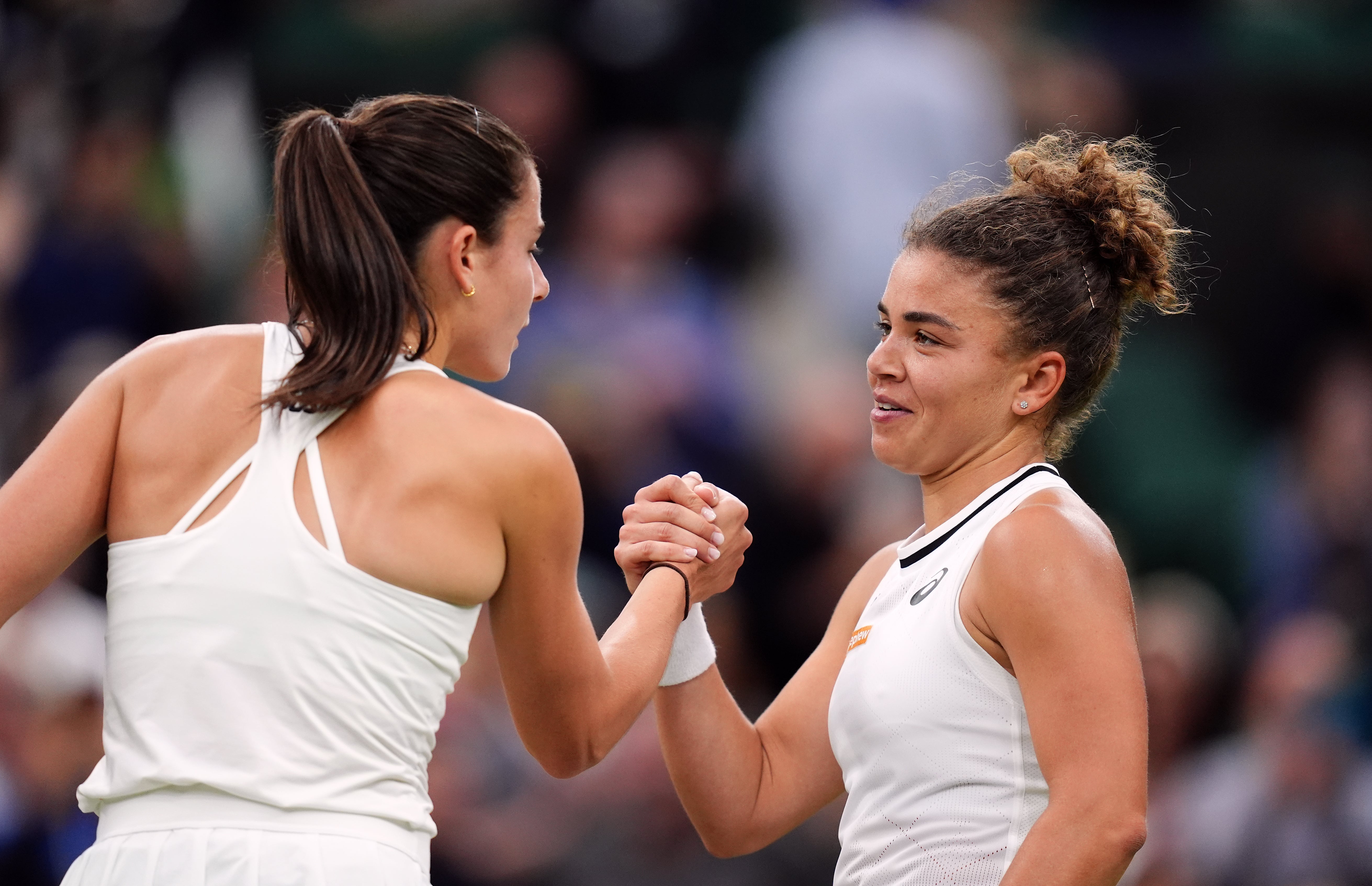 Jasmine Paolini and Emma Navarro shake hands (John Walton/PA)