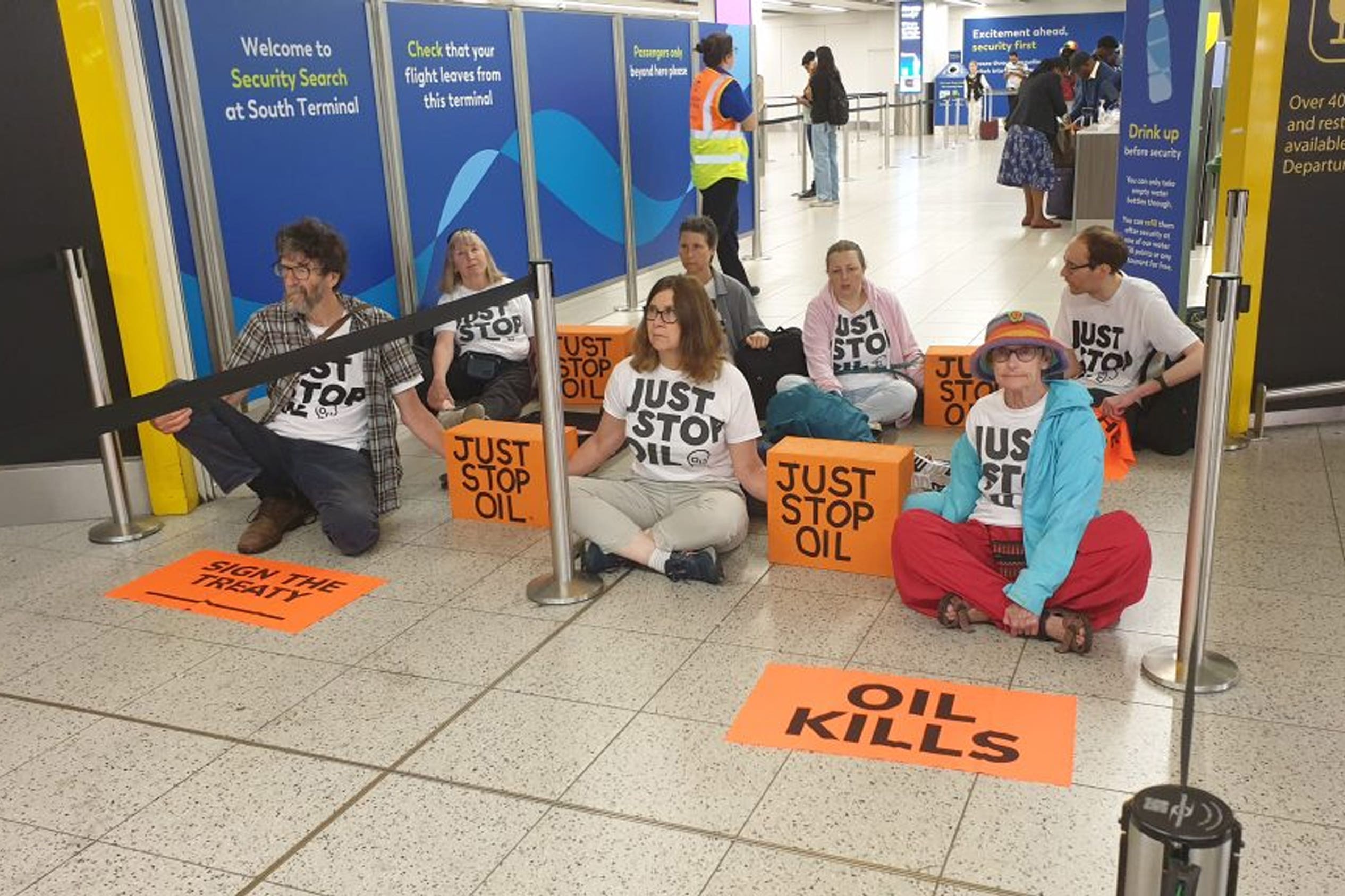 Protesters blocking the departure gates at Gatwick Airport (Just Stop Oil)