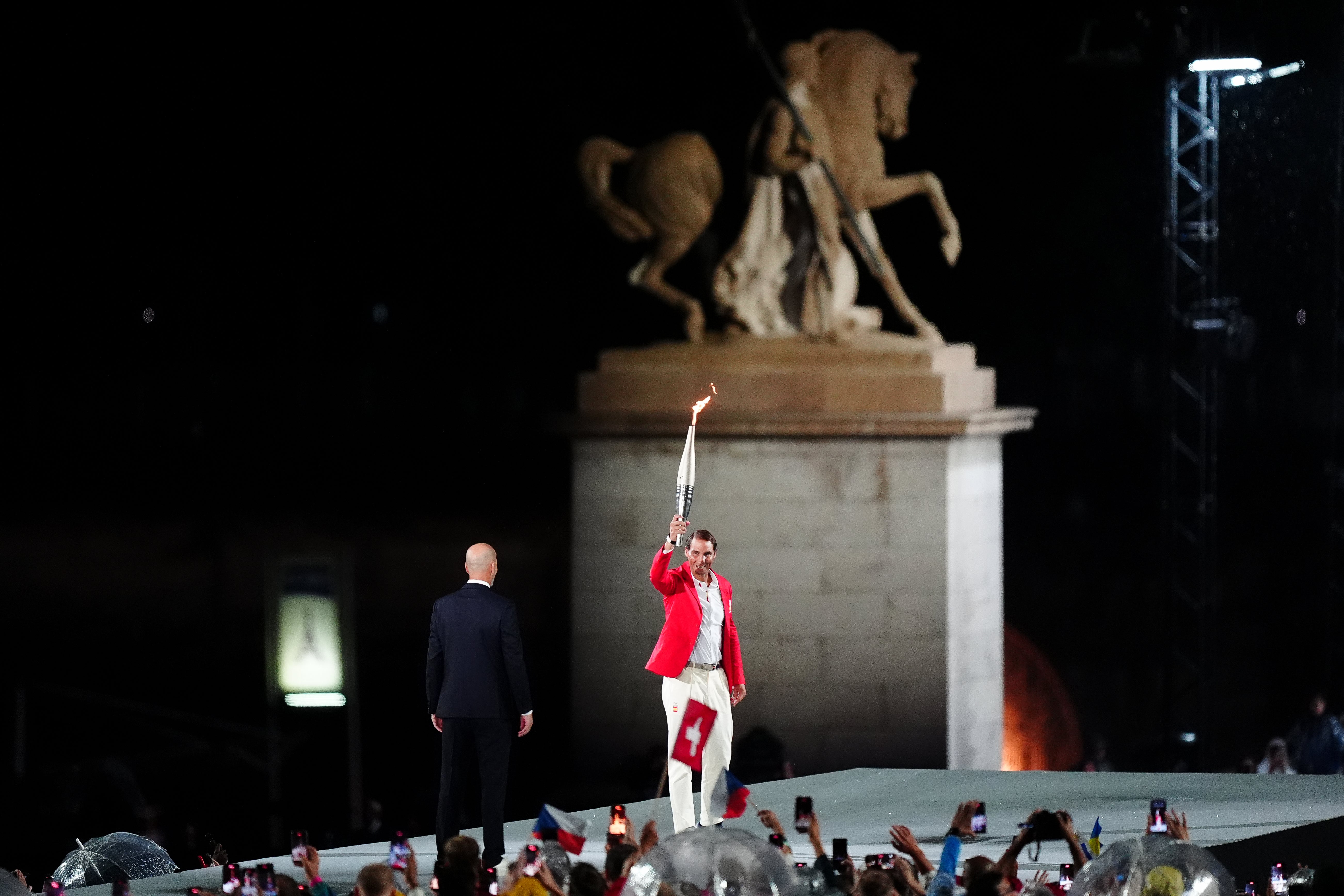 Rafael Nadal carries the Olympic torch at the opening ceremony (Mike Egerton/PA)