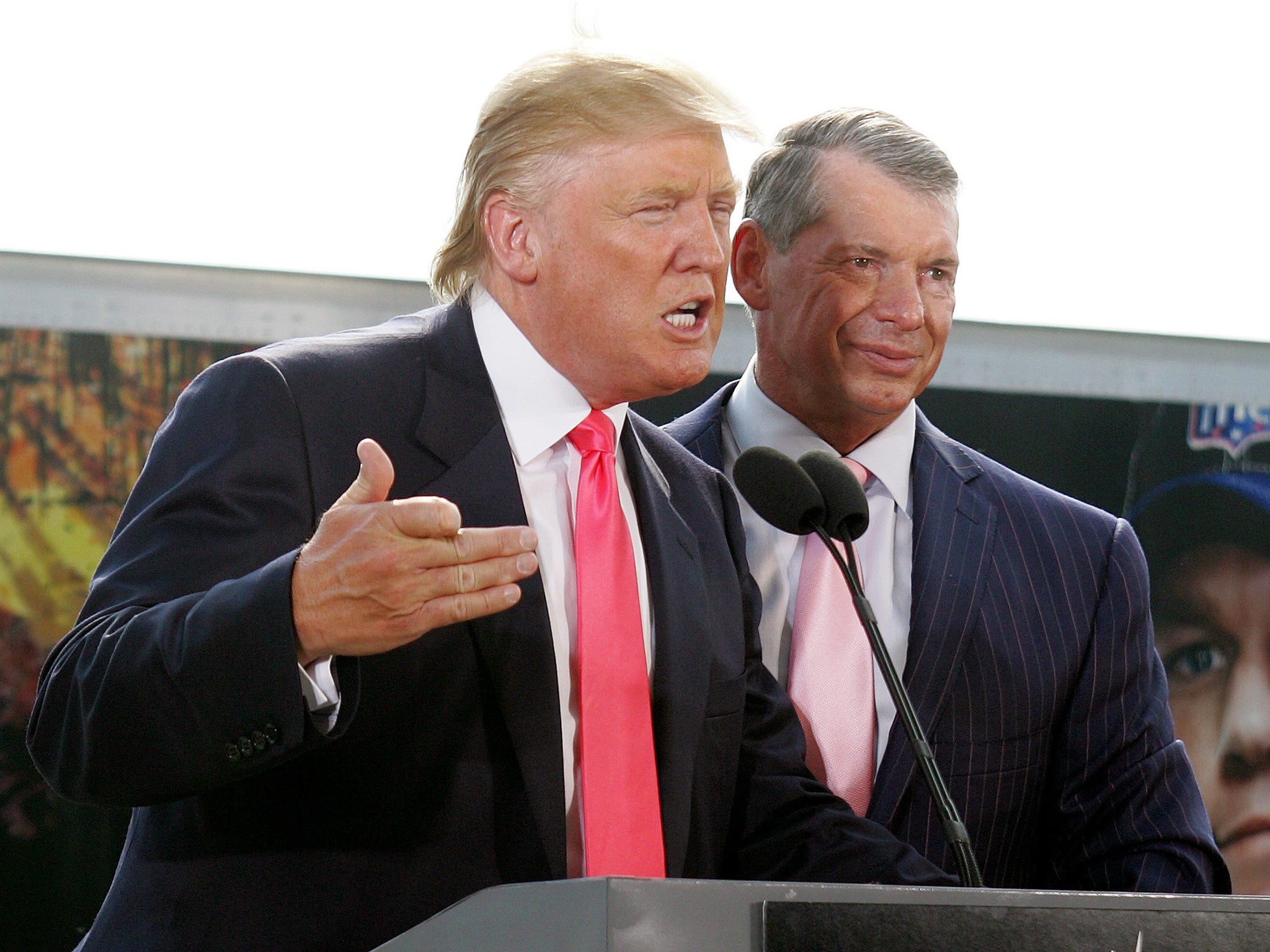 Trump speaking at a press conference with Vince McMahon