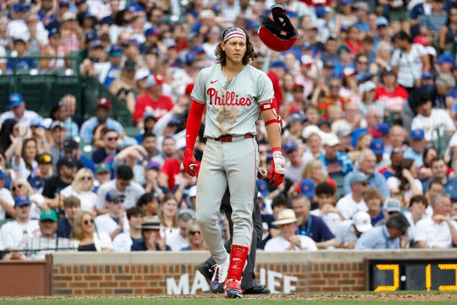 Philadelphia Phillies third baseman Alec Bohm reacts after striking out against the Chicago Cubs during the eighth inning on Thursday, July 4, 2024, at Wrigley Field in Chicago.