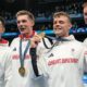 Britain's men's 4x200-meter freestyle relay team pose with their gold medals at the 2024 Summer Olympics, Tuesday, July 30, 2024, in Nanterre, France. (AP Photo/Matthias Schrader)