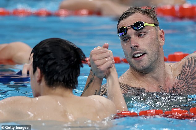 Chalmers shakes Zhanle's hands after claiming a silver medal in the 100m Freestyle