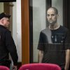 Wall Street Journal reporter Evan Gershkovich stands in a glass cage of a Russian courtroom on July 19. A Russian court convicted Gershkovich on espionage charges that his employer and the U.S. have rejected as fabricated. He was sentenced to 16 years in prison after a secretive and rapid trial.