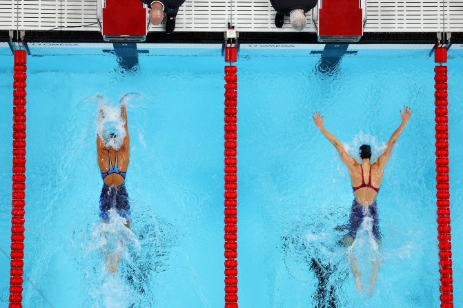 American swimmer Torri Huske, left, edges teammate Gretchen Walsh as they finish 1-2 in the 100-meter butterfly on July 28.