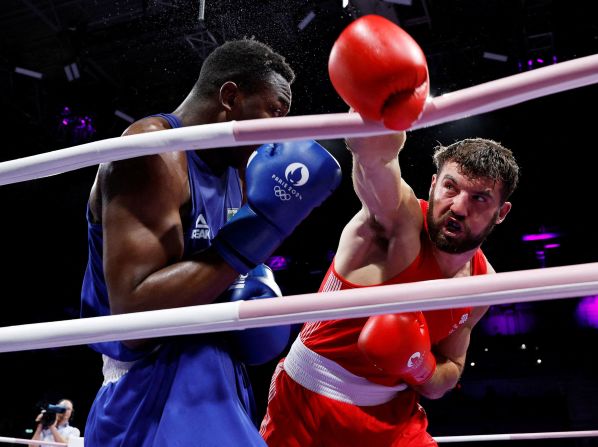 Great Britain's Patrick James Brown swings at Brazil's Keno Marley Machado during a heavyweight bout on July 28. Machado won 4-1.