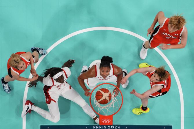 From left, Japan's Saori Miyazaki, the United States' Kahleah Copper, the United States' Alyssa Thomas, Japan's Saki Hayashi and Japan's Maki Takada watch the ball go through the hoop during their first basketball game in Paris on July 29. Team USA won 102-76 in what was a rematch of the gold-medal game three years ago. The United States has won 56 consecutive Olympic games.