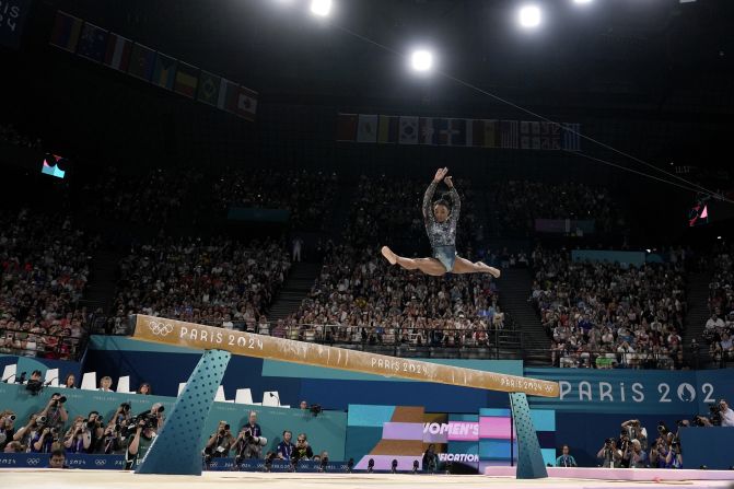 US gymnast Simone Biles competes on the balance beam during the Olympic qualification round on July 28. She landed awkwardly while warming up for her floor routine, but she fought through the pain to post an impressive all-around score.