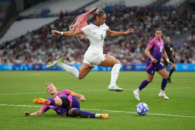 US forward Trinity Rodman jumps over Germany's Alexandra Popp during the Americans' 4-1 victory on July 28.